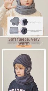 Detail of children's grey knit hat and scarf set with thick fleece lining and snowflake pattern