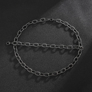 Detailed close-up of dark grey twisted O-chain link bracelet and necklace metal texture