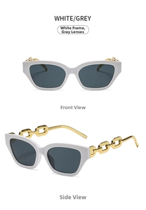 Detail view of cat-eye sunglasses featuring white frames and gold chain metal temples