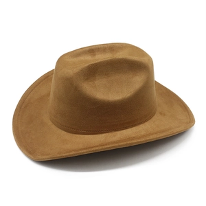 Top view of classic brown suede cowboy hat with stylish indented crown and flat brim