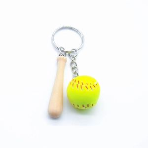 Detail of mini wooden baseball bat and yellow softball keychain with metal ring