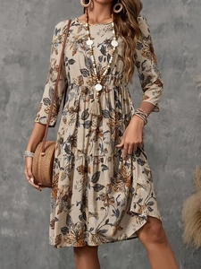 Elegant floral print bohemian dress with 3/4 sleeves and tiered skirt in beige linen blend