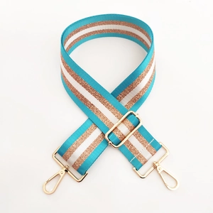 Detail view of 5cm wide striped shoulder strap with teal, white and gold metallic thread