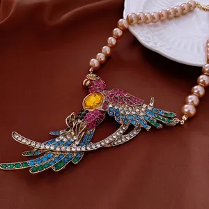 Vintage parrot pendant necklace with colorful crystals and faux pearl chain in retro style