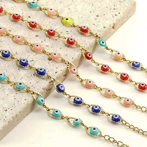 Colorful Evil Eye bracelets set in gold stainless steel finish displayed on stone