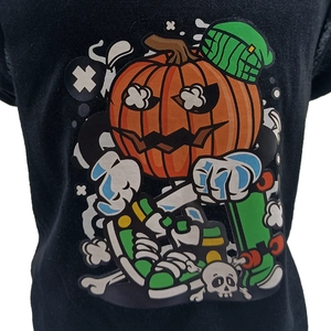 Detailed view of Halloween pumpkin skater print on a black cotton pet T-shirt