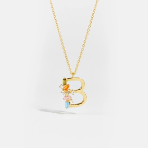 Close-up of golden S925 sterling silver letter B pendant with colorful zircon stones
