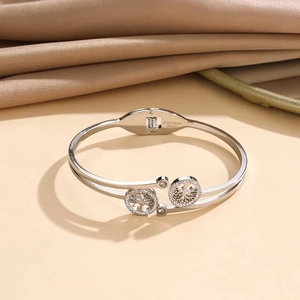 Detailed macro view of silver tree of life bracelet with stainless steel engraving