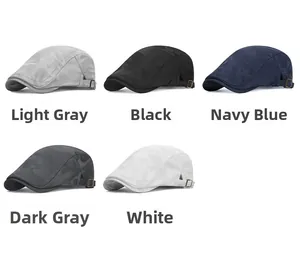 Detail of five camouflage mesh beret caps showing side metal buckles and varied colors
