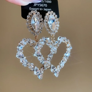 Exquisite double heart drop earrings featuring marquise and round cut crystals