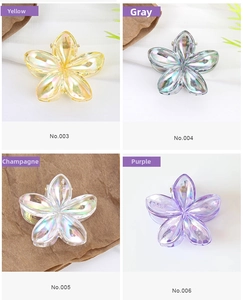 Detailed collage of colorful acrylic flower hair clips with a vibrant laser holographic finish
