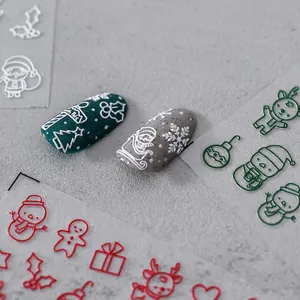 3D embossed Christmas nail stickers with Santa, reindeer and snowflakes on green manicure