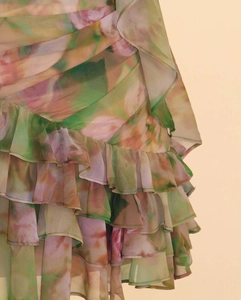 Detailed view of lightweight floral chiffon ruffles and delicate hemline craftsmanship