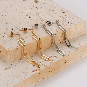 Chic paperclip link drop earrings in gold and silver finish on textured stone
