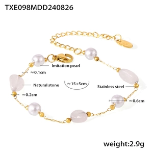 Detail view of irregular pink stone and pearl bracelet with size measurements and lobster clasp