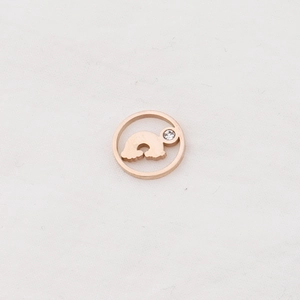 Detailed macro view of rose gold hollow rainbow pendant with sparkling zircon accent
