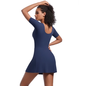 Slim fit navy blue tennis dress with short sleeves and U-neckline on white background