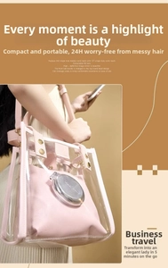 Detail of portable folding brush showing the 127 bristles and high-definition mirror