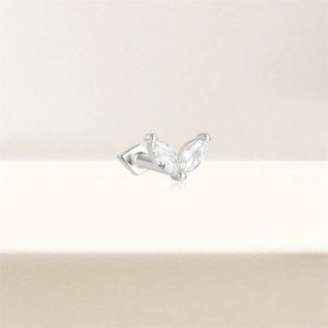 Macro shot of 925 sterling silver marquise-cut zircon flower cartilage stud earring