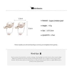 Detail view of double pearl earrings with silver chain, size 3.5cm by 1.5cm, weight 4.7g