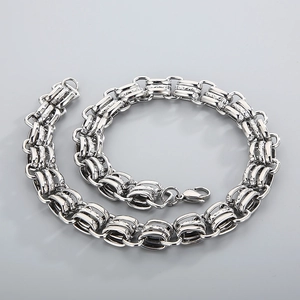 Flat lay of 15mm wide stainless steel chunky chain necklace with lobster clasp