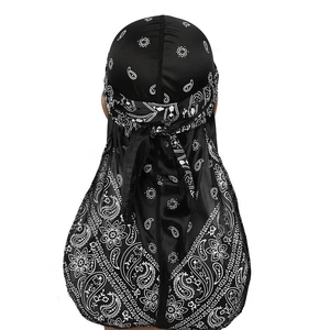 Detail of black paisley durag with long tail showing silky texture and pattern