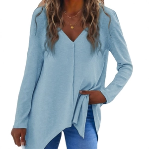 Women's light blue V-neck knit sweater with long sleeves and asymmetric hem detail