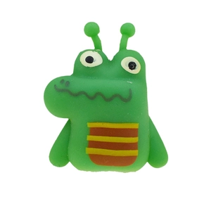 Detailed close-up of a green TPR crocodile finger puppet toy with orange striped belly