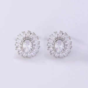 Detailed view of silver flower stud earrings featuring clear crystal petals and zircon