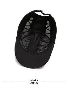 Detail view of the breathable mesh inner lining and adjustable strap of the black sports cap