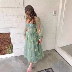 Elegant sage green corset tulle midi dress with floral embroidery and puff sleeves