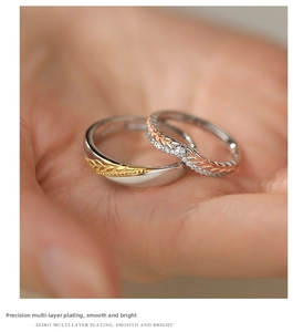 Detailed view of wheat motif couple rings with s925 silver plating and zircon inlay