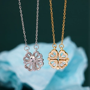 Folding four-leaf clover heart necklace in gold and silver steel with magnetic pendants