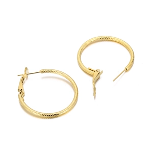 Textured gold hoop earrings with twisted metallic pattern and polished finish for women