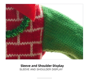 Detail of red and green knitted Christmas wine bottle cover with brick texture and glitter
