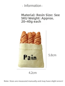 Close-up of a 3D resin baguette bread fridge magnet showing realistic texture and size detail