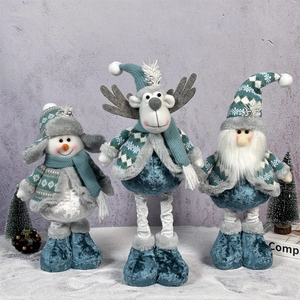 Detailed view of plush Christmas dolls snowman reindeer and Santa in blue and white tones