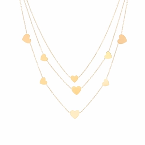 Detail of triple-layer gold titanium steel necklace with multiple heart pendants