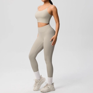 Side view of high-waist yoga set with slim-fit sports tank top and leggings in light khaki