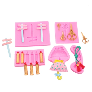 Pink silicone DIY mold set for fondant including umbrella scissors and candle shapes