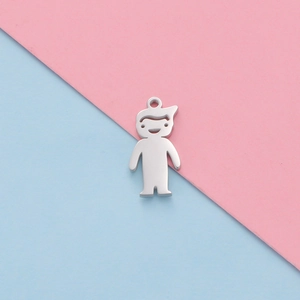 Polished silver boy and girl shaped stainless steel pendants on two-tone background