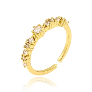 Close-up of luxury 18K gold plated copper ring with micro-set zircon stones on white base