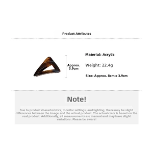 Detail view of large amber triangular hair claw clip with size 8cm and 3.9cm specs