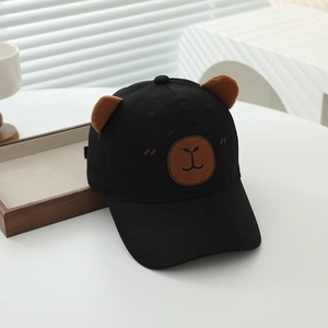 Detail of black cotton kids baseball cap with plush bear ears and embroidery