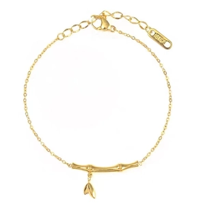 Elegant 18k gold plated bamboo joint bracelet with leaf pendant on white background