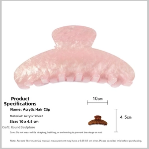 Macro detail of pink marble acrylic hair claw clip showing precise 10x4.5cm dimensions