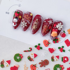 3D Christmas nail stickers and press-on nails set featuring snowman and gingerbread man