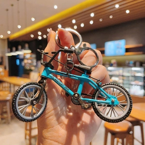 Sky blue miniature mountain bike keychain with realistic alloy frame and lobster clasp