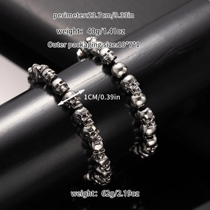 Detail showing two weights of vintage punk skull bracelets 40g and 62g in retro silver finish