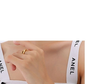 Detailed view of intertwined golden rings featuring a multi-layered woven band design
